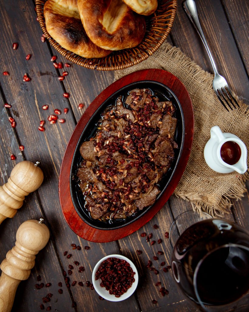 Fried meat slices with pomegranate